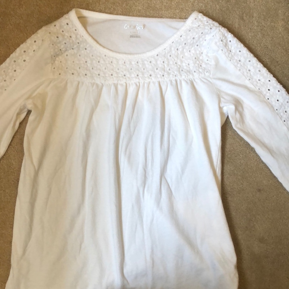 White long sleeve shirt with flowers on top